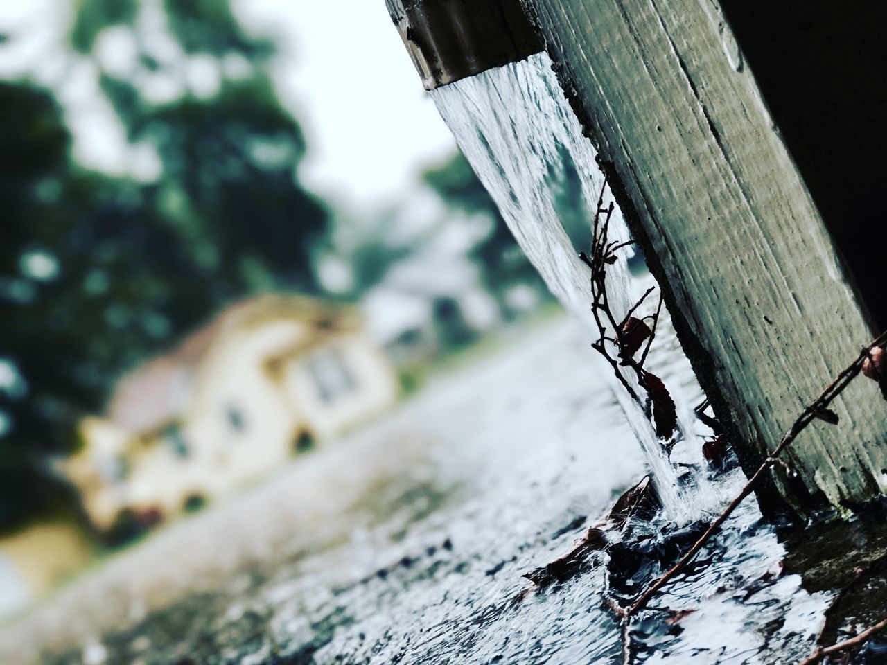 Mastering the First Impression: Your intriguing post title goes here Close-up of rainwater flowing from a gutter during a storm, capturing the essence of rainy weather.